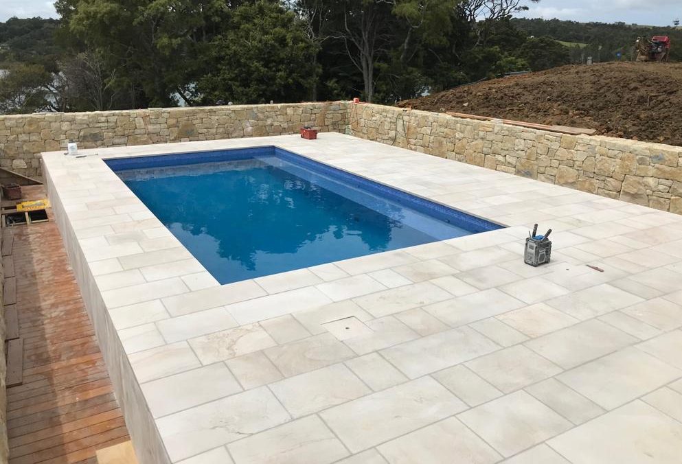 Elevated pool with natural stone surrounds — recent Bespoke Tiling Solutions work